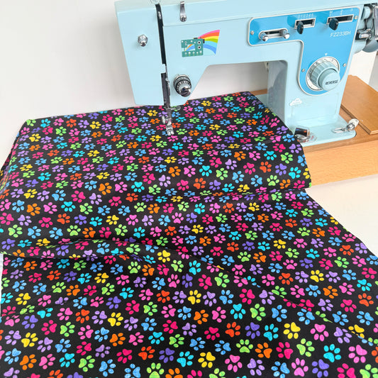 Timeless Treasures - Rainbow Paw Prints - Black