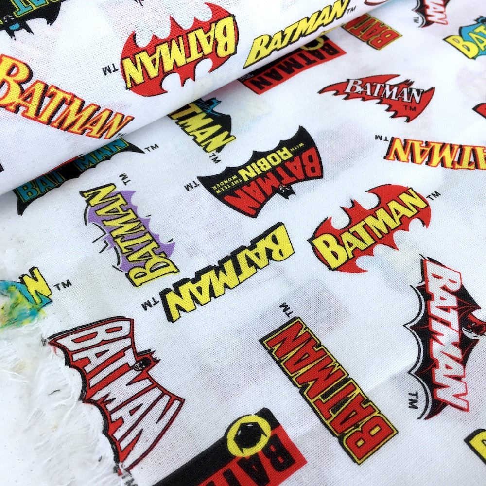 Quilting Cotton - DC Heroes & Heroines - Batman Logo History White (Per Metre)