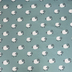 Frolicking Sheep French Terry Fabric in Dusty Teal
