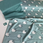 Frolicking Sheep French Terry Fabric in Dusty Teal