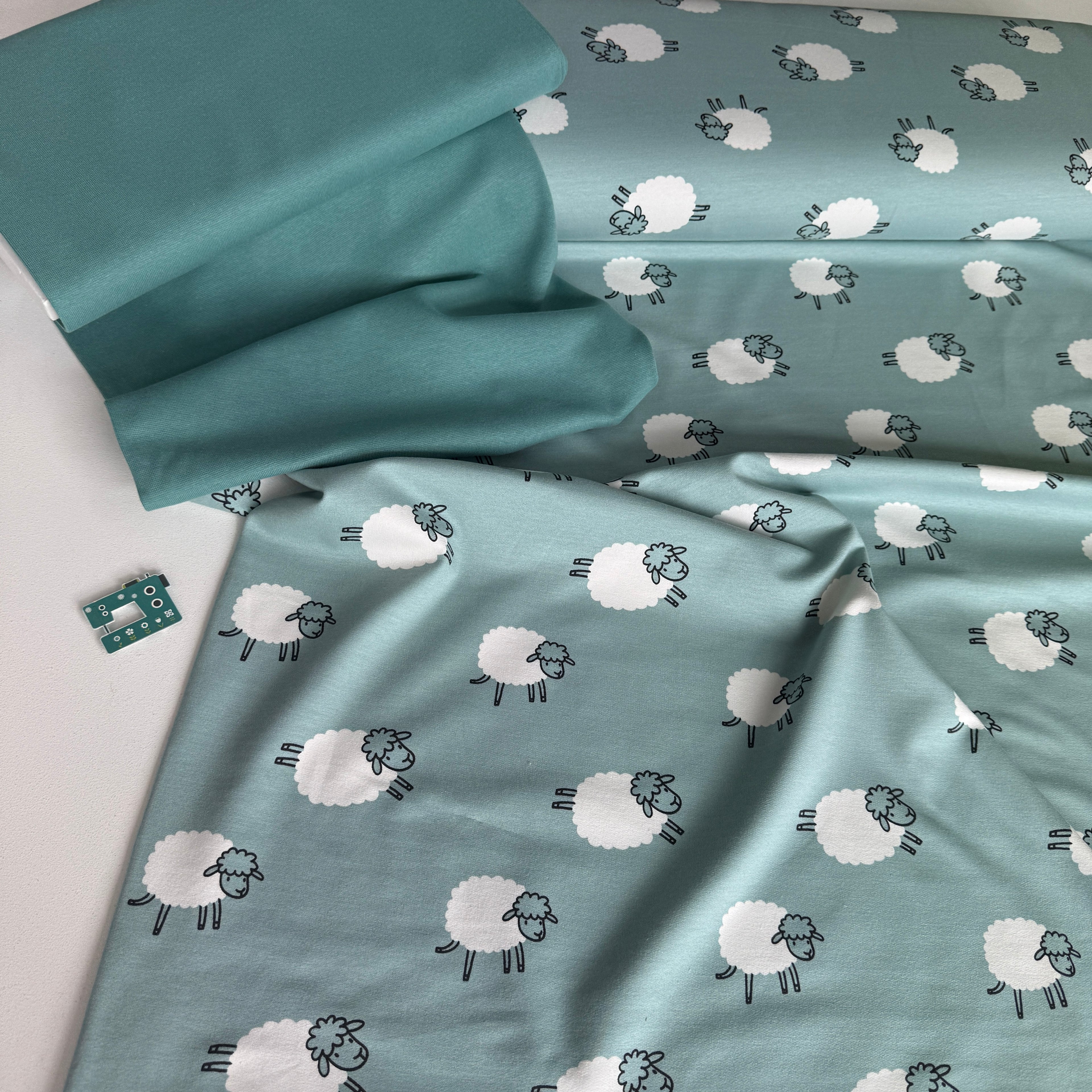 Frolicking Sheep French Terry Fabric in Dusty Teal
