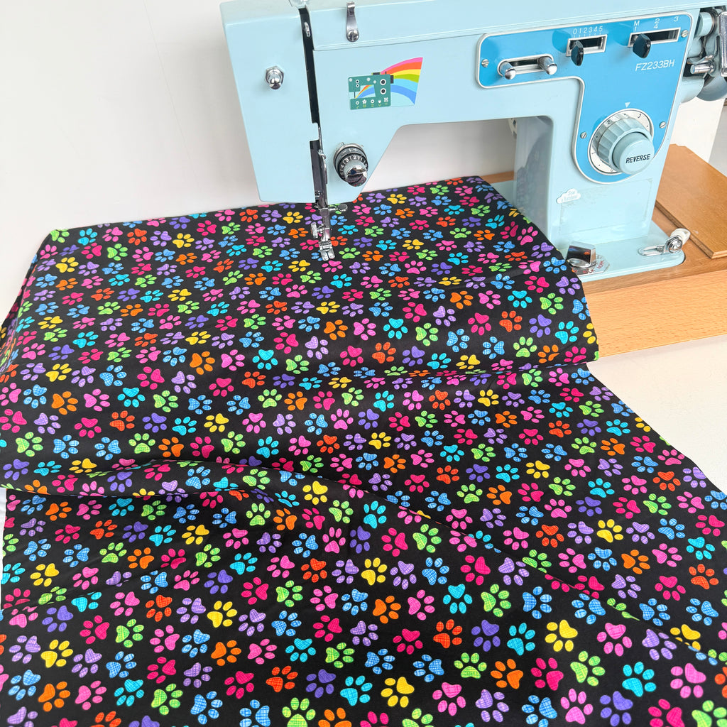 Timeless Treasures - Rainbow Paw Prints - Black
