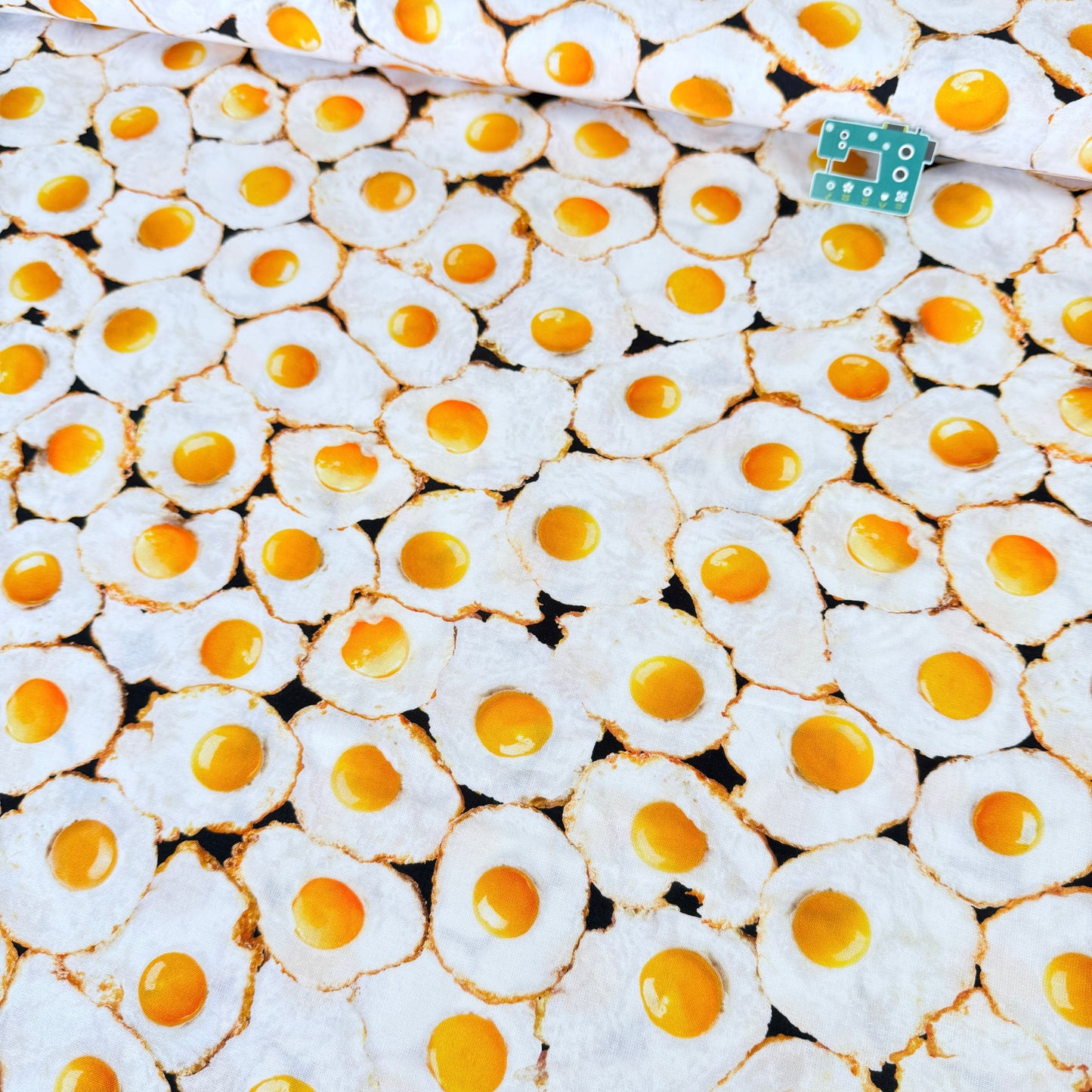 Fried Eggs (White) Fabric by Timeless Treasures