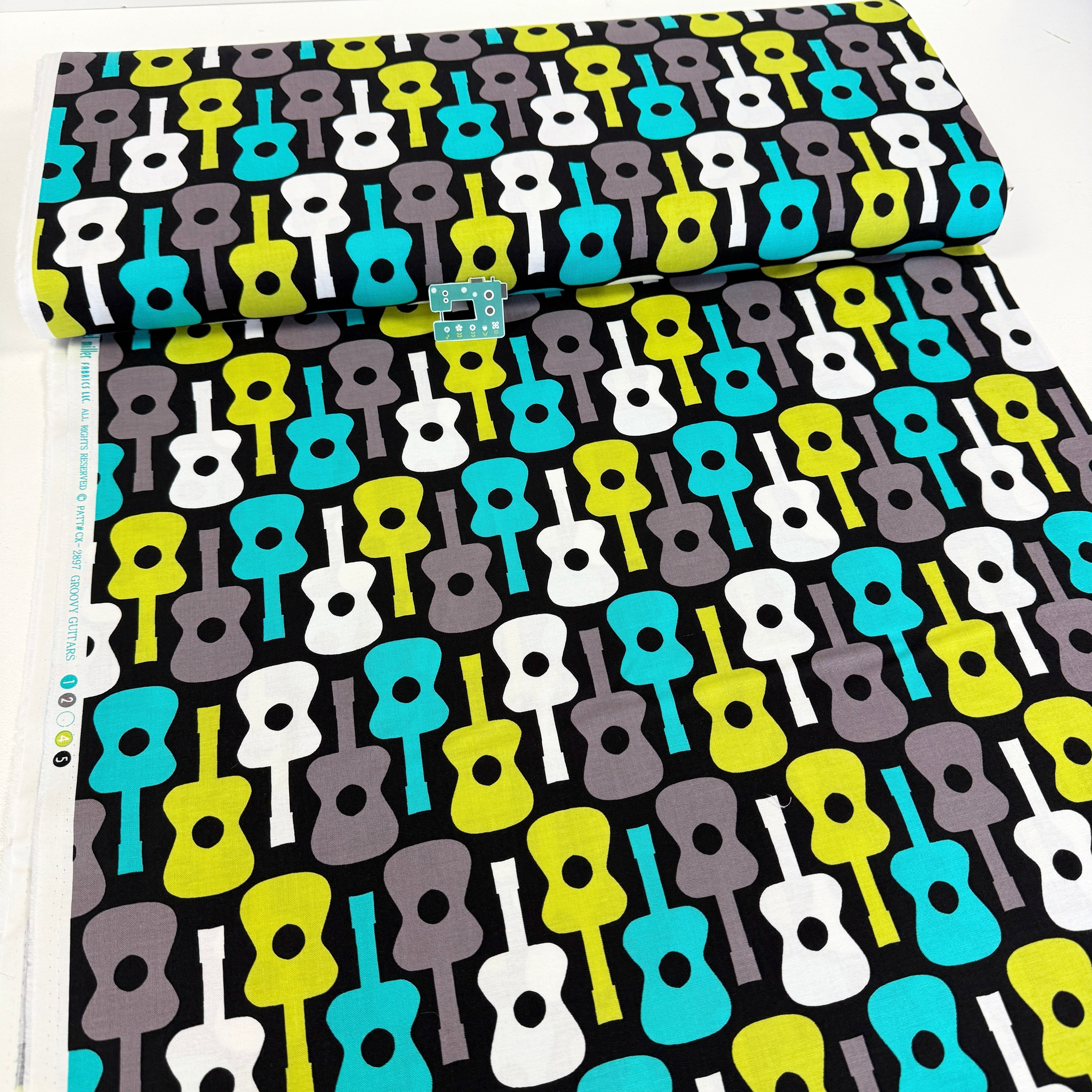 Remnant of Groovy Guitar (Lagoon) Quilting Fabric by Michael Miller (148cm)