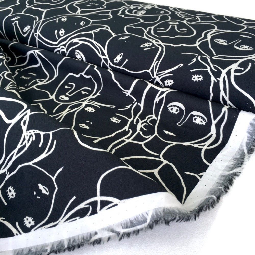 Crowded Faces Cotton Lawn Fabric Black - Frumble Fabrics