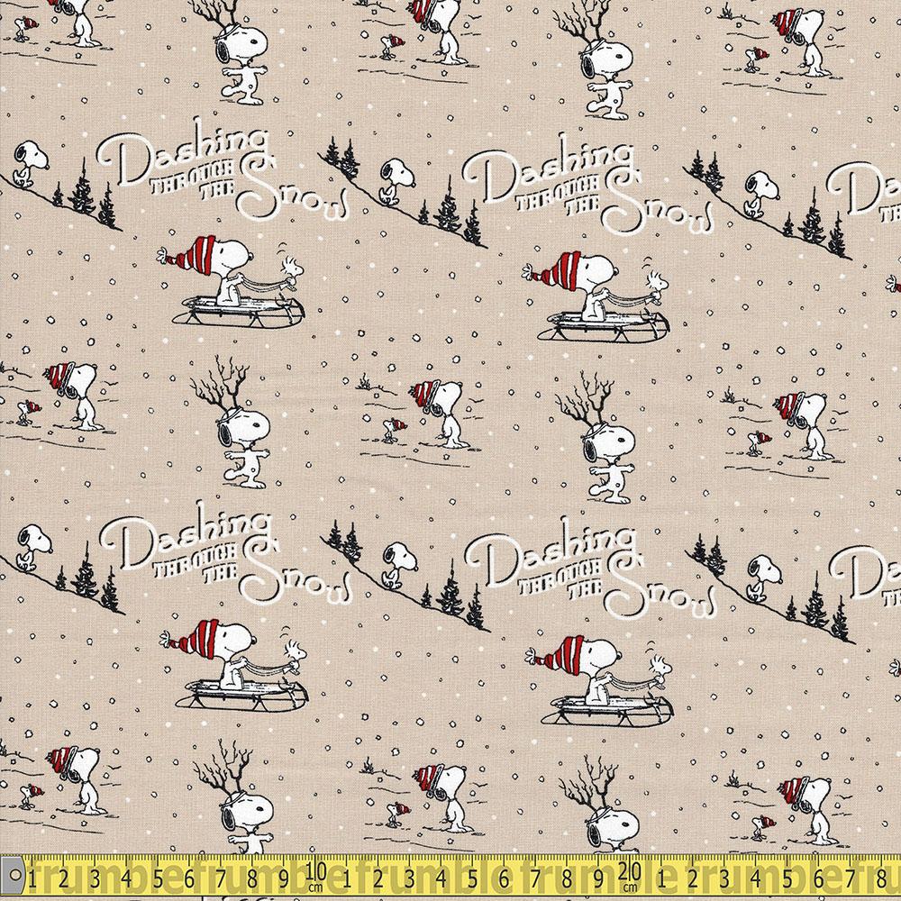 Peanuts - Snoopy - Dashing Through The Snow Tan Sewing and Dressmaking Fabric